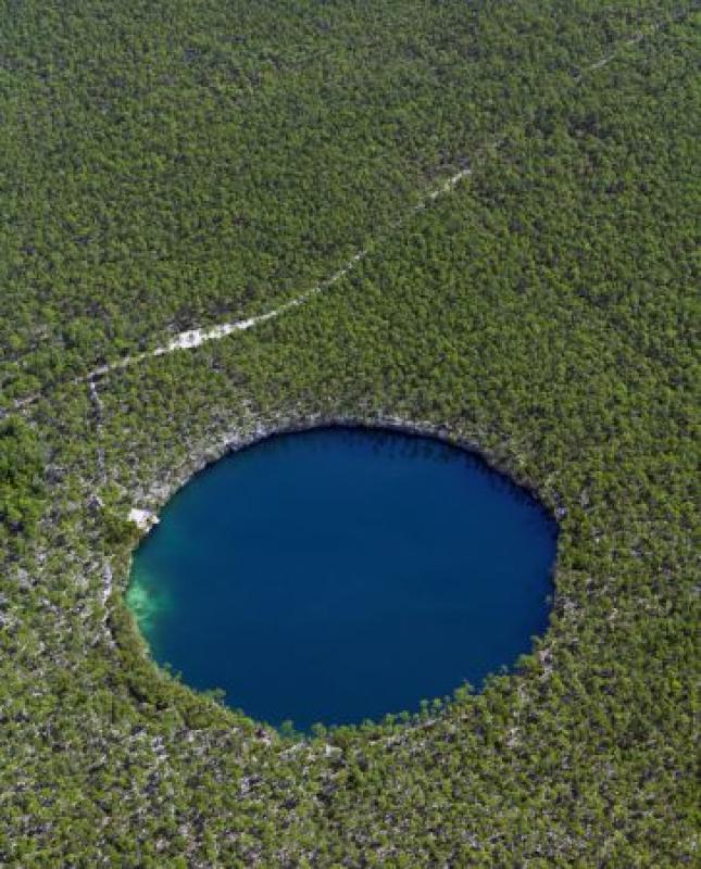...dotted with Blue Holes that provide access to underwater caverns...