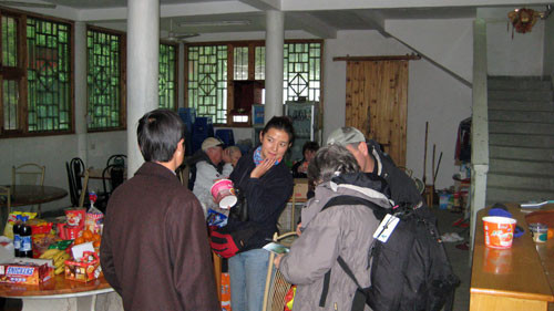 But of course not everything is elegant.  Here we use a riverside building offered to us as shelter from the rain for our typical picnic lunch of hot noodles (yummy…), breads, fruit, and yogurt among other things… Credit: Will Russell