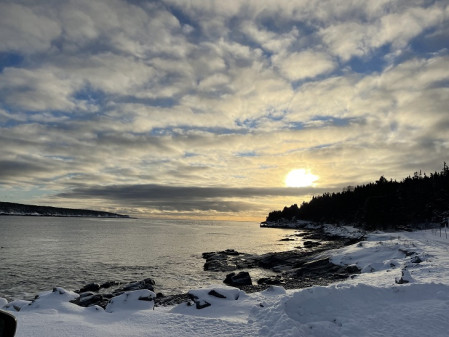 Sunset over a snow-covered bay