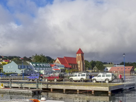 The colorful waterfront (and famous whale-bone arch) of Port Stanley herald our arrival to the remote Falkland Islands....
